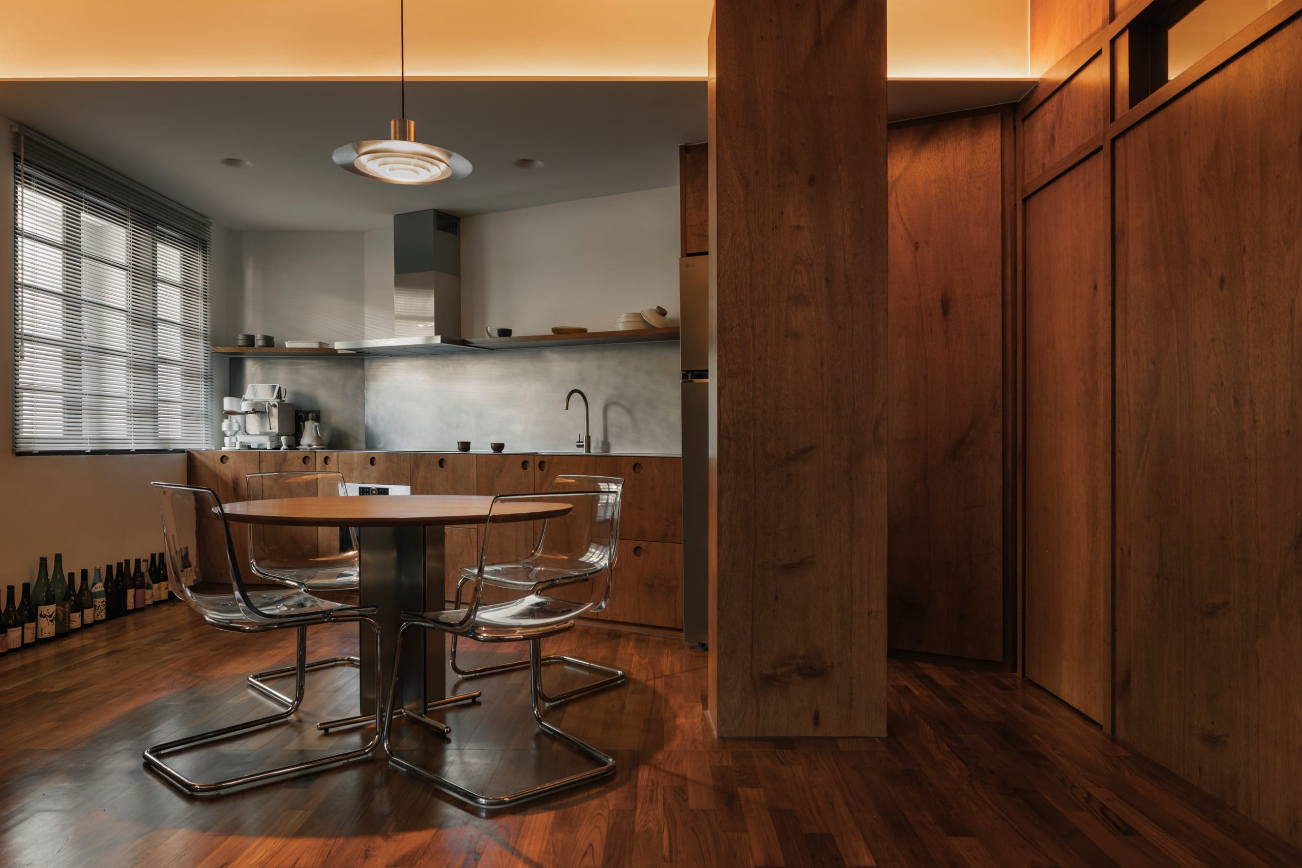 A serene home interior with natural materials and light falling across the living space